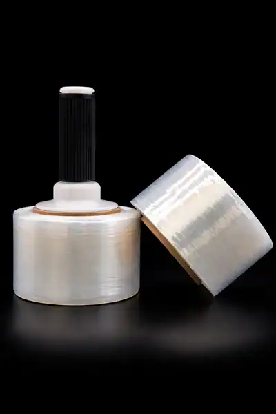 Industrial tape dispenser with roll of sealing tape for sealing and insulation tasks.